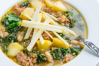 Opal® Apple, Sausage, Kale, and White Bean Soup