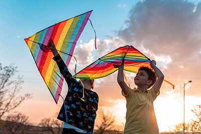 kids flying colorful kites