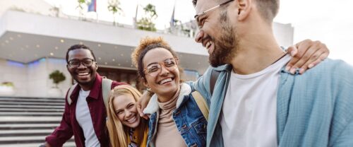 4 college friends smiling