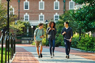 students walking outside on campus